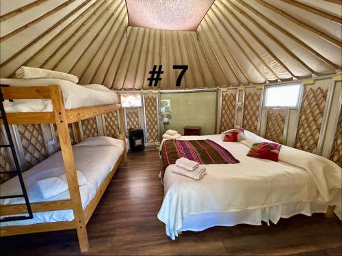 a bedroom with two bunk beds in a yurt at Loma Sanchez in San Pedro de Atacama