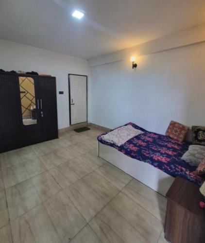 a bedroom with a bed in a room at Happy Farmstead in Darjeeling