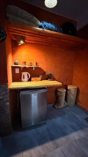 a small kitchen with a sink and a counter with a sink at Maité Hospedaje in Santa María