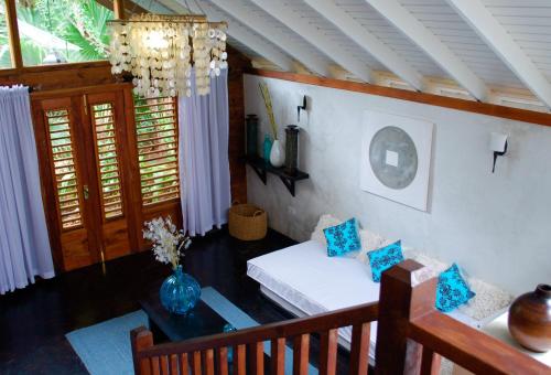 a living room with a couch and a table at Villas Sur Mer in Negril