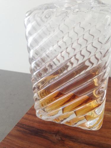 a clear glass vase sitting on top of a wooden table at Quarry House Luxury Retreat in Hobart