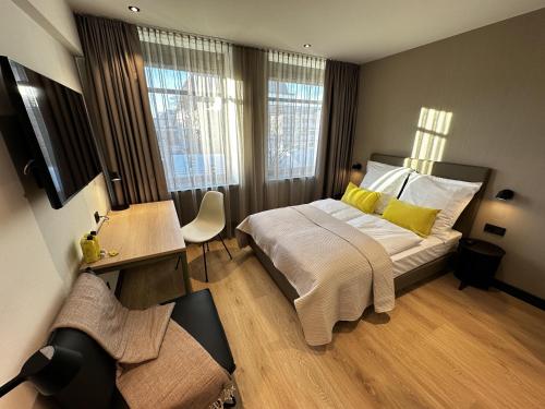 Llit o llits en una habitació de ipartment Koeln Oper @HOME by Best Western