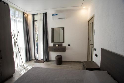 a bathroom with a sink and a mirror at Magnetoria 3 BR House in pine forest - 3 mins to the sea in Urekis Sadguri