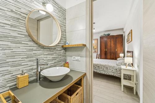 a bathroom with a sink and a mirror at Casa Due Spighe in San Sperate