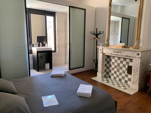 a living room with a couch and a fireplace at Albert Molière in Brussels