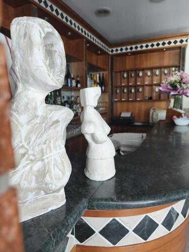 a white sculpture on a counter in a kitchen at Albergo La Maria in Fiumaretta di Ameglia