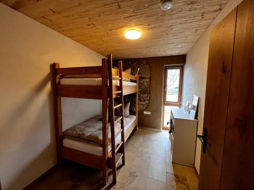 a room with bunk beds in a house at Ferienhof Forstmoar in Gars am Inn