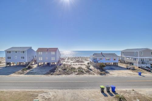 a row of houses on the beach next to the ocean at Life Is Good in Oak Island