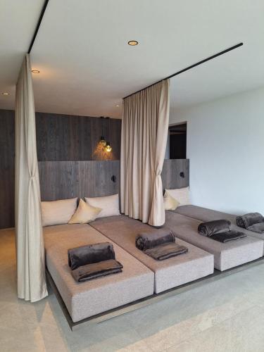 a bedroom with two beds in a room at Residence Gloria Dei in Schenna