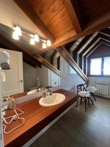 a large bathroom with a sink and a counter at HOTEL RURAL Casa Campo in Abay