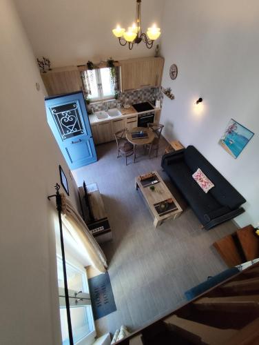 an overhead view of a living room with a couch at Blue house II in Palekastron