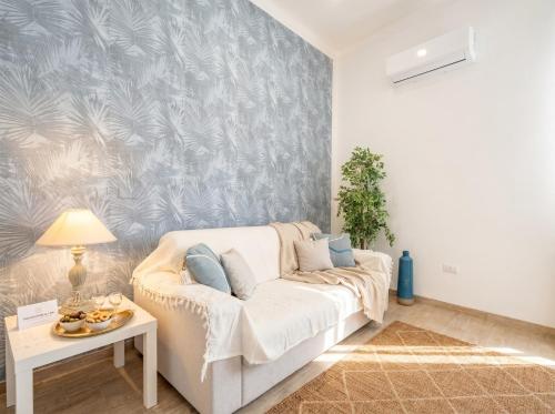 a living room with a couch and a table at Casa Bambu in Polignano a Mare