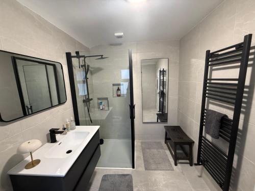a white bathroom with a sink and a shower at Cavan Equestrian Estate - An Independent On-Site Accommodation in Cavan