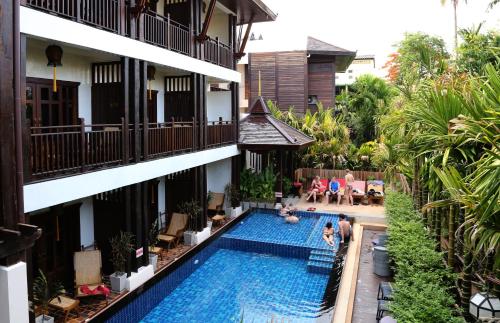 an overhead view of a swimming pool in a building at Viang Thapae Resort in Chiang Mai