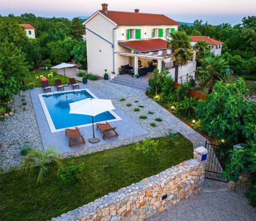 an aerial view of a house with a swimming pool at Crassula Summer Villa with Private Pool in Kras