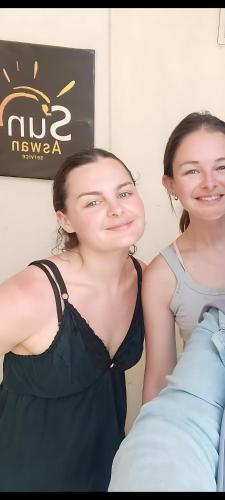 two girls are standing next to each other at Sun Aswan inn in Aswan