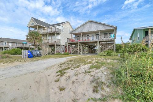 a large house on the beach with a dirt road at No Worries in Oak Island