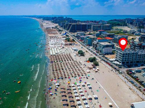 an aerial view of a beach with umbrellas and chairs at Lemon Cliff Luxury B&B in Mamaia Sat/Năvodari