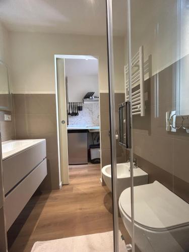 a bathroom with a shower and a toilet and a sink at Putti giocosi in Genoa