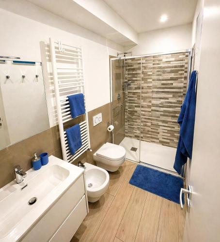 a bathroom with a toilet and a sink and a shower at BiloVarazze with Terrace in Varazze