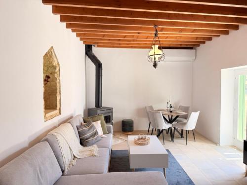 a living room with a couch and a table at Estia Vouni Boutique Houses in Vouni