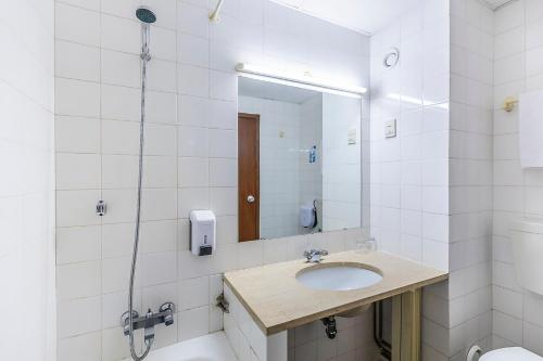 a bathroom with a sink and a mirror at HI São Pedro do Sul – Pousada de Juventude in Termas de Sao Pedro do Sul
