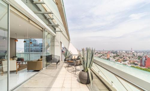 a balcony with a view of a city at Casa Reforma by Kukun in Mexico City