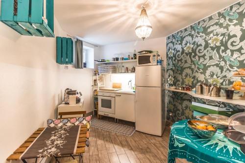 Kuchyň nebo kuchyňský kout v ubytování Riad Rooms
