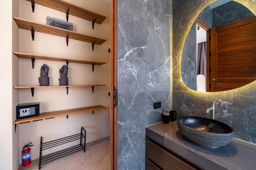 a bathroom with a sink and a mirror at Demaya Villa 5 in Ko Phangan