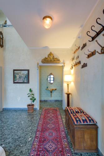 a living room with a bed and a rug at Scenarium in Udine