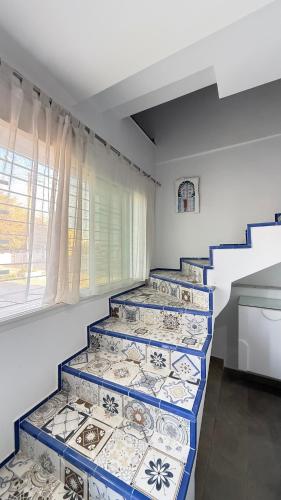 a row of steps in a room with a window at Sidi bou duplex in La Goulette