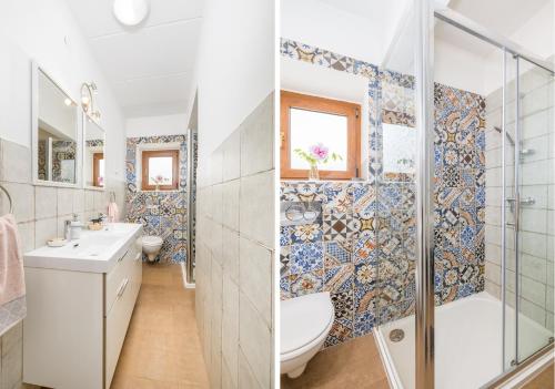 a bathroom with a toilet sink and a shower at Funcic Apartments 1 app in Pula