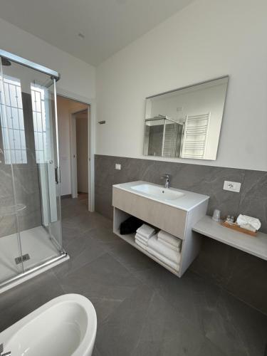 a bathroom with a sink and a shower at Tesorella guest house in Cassano dʼAdda