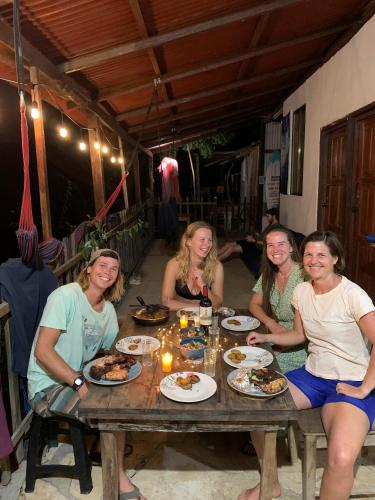 a group of women sitting at a table eating food at Casa Medusa in El Gigante