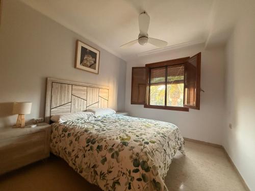 a bedroom with a bed and a window at Charming Home in Lorca Murcia in Lorca