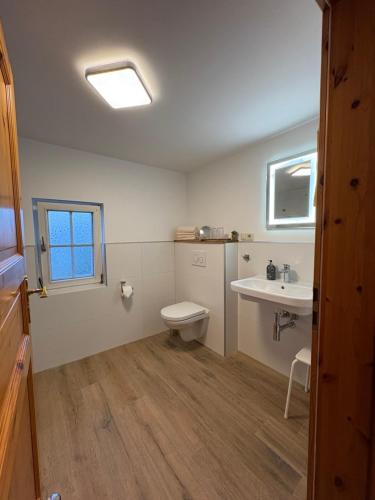 a bathroom with a toilet and a sink at Ferienhaus Eifelperle in Blankenheim