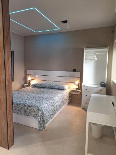 a bedroom with a bed and a blue light at Smarthome Boutique, Collegno in Collegno