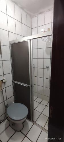 a bathroom with a toilet and a shower at Casa XV de novembro em Garanhuns in Garanhuns