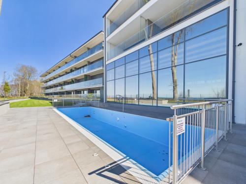 an empty swimming pool in front of a building at Baltic Horizon Klifowa by Solarento in Rewal