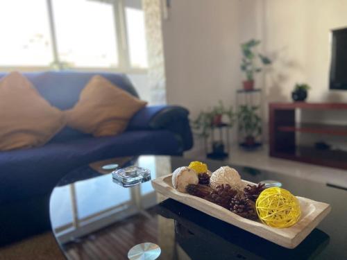 a bowl of food on a table in a living room at Lenny's house I in Agualva