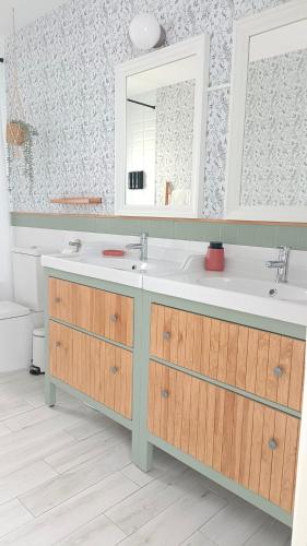 a bathroom with a sink and a mirror at Villa Sueños in Mijas