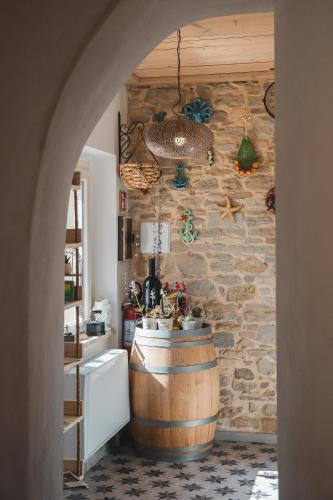a bathroom with a barrel sink and a stone wall at Borgo del Marchese in Ortona