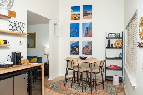 a kitchen with a table and chairs in a room at True North - A Beach & Boat Lover's Dream in Carolina Beach