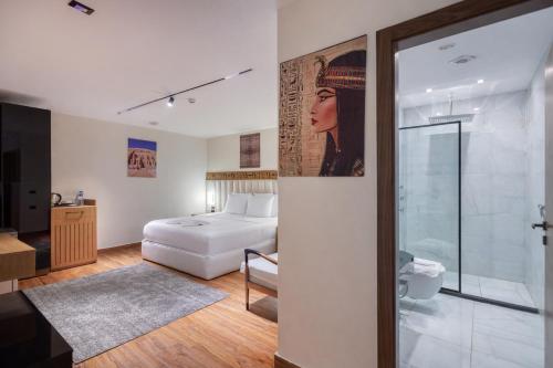 a hotel room with a bed and a bathroom at Superior Pyramids View in Cairo