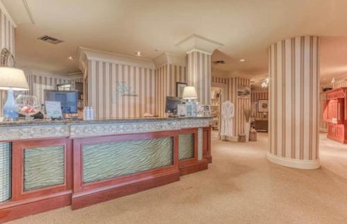 a large room with a large aquarium in a house at Breathtaking Views Emerald Grande 3BR,2BA 904E in Destin