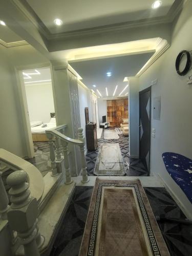 a hallway of a home with a living room at Kemet Pyramids Apartments in Cairo