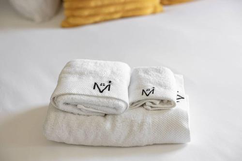 two towels sitting on top of a white table at Quiet Avon Retreat in Indianapolis