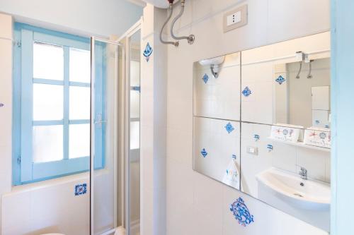 a bathroom with a shower and a sink at Blue View - A Due Passi dal Mare & Natura in Quartu SantʼElena