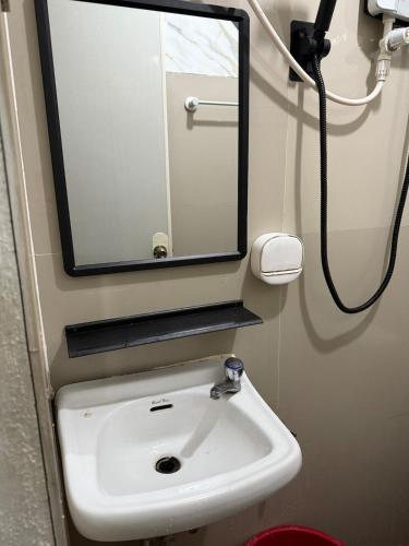 a bathroom with a sink and a mirror at PrincessStar in Pagadian
