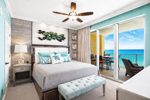 a bedroom with a bed and a view of the ocean at Luxury Beachfront Condo Free Beach Chairs Huge Balcony Come Relax! in Panama City Beach